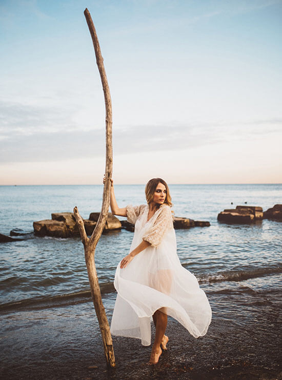 Bride posing on the beach