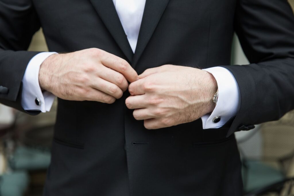 groom-buttoning-jacket