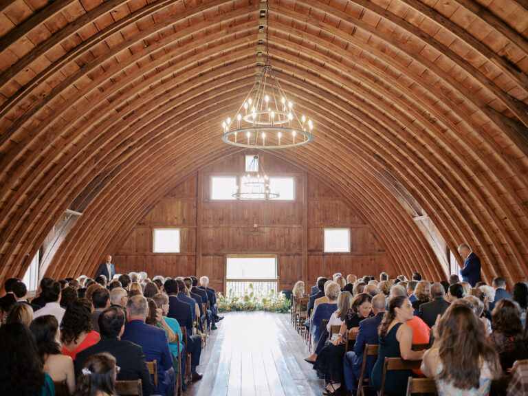 Wedding ceremony inside a vaulted wood barn in Northeast Ohio