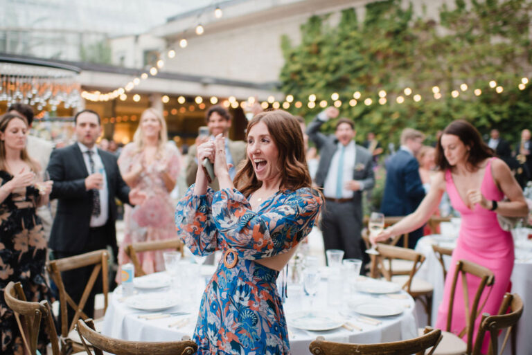 Wedding guest celebrating during a reception on Geis Terrace at the Cleveland Botanical Garden
