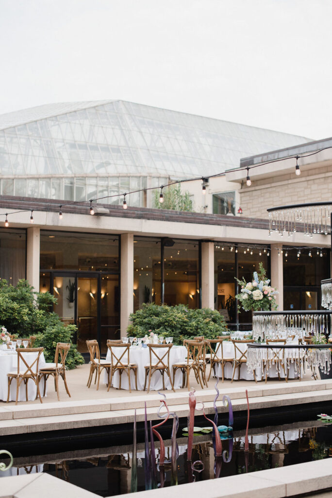 Outdoor wedding reception beside the glasshouse on Geis Terrace at the Cleveland Botanical Garden