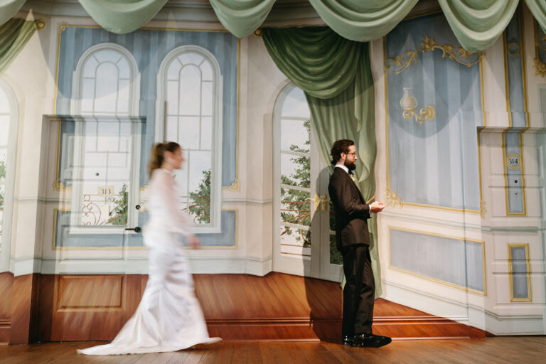Bride approaching the groom for a first look inside a historic New Orleans venue