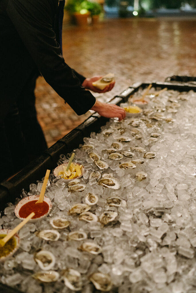 Fresh oyster bar highlighting local cuisine at a destination wedding