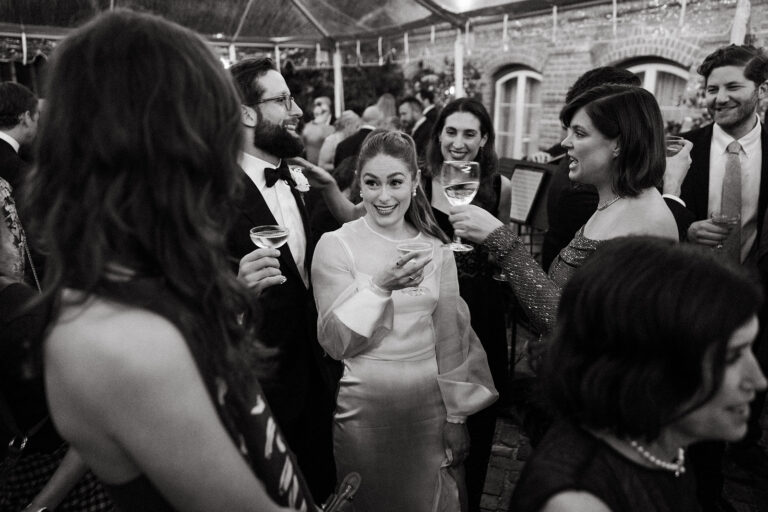 Bride and wedding guests enjoying cocktail hour in New Orleans