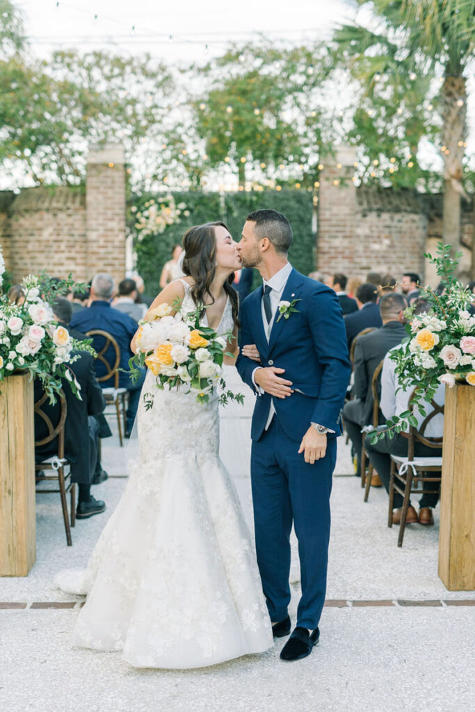 Bride and groom kissing after their outdoor ceremony at The Gadsden House