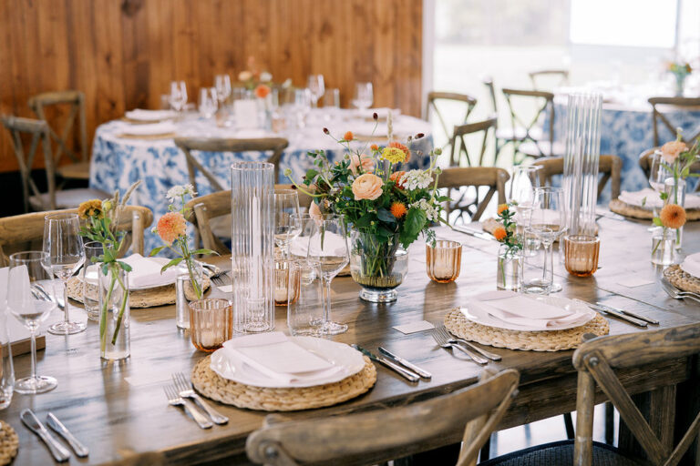 Fall wildflower centerpieces on a rustic wedding reception table